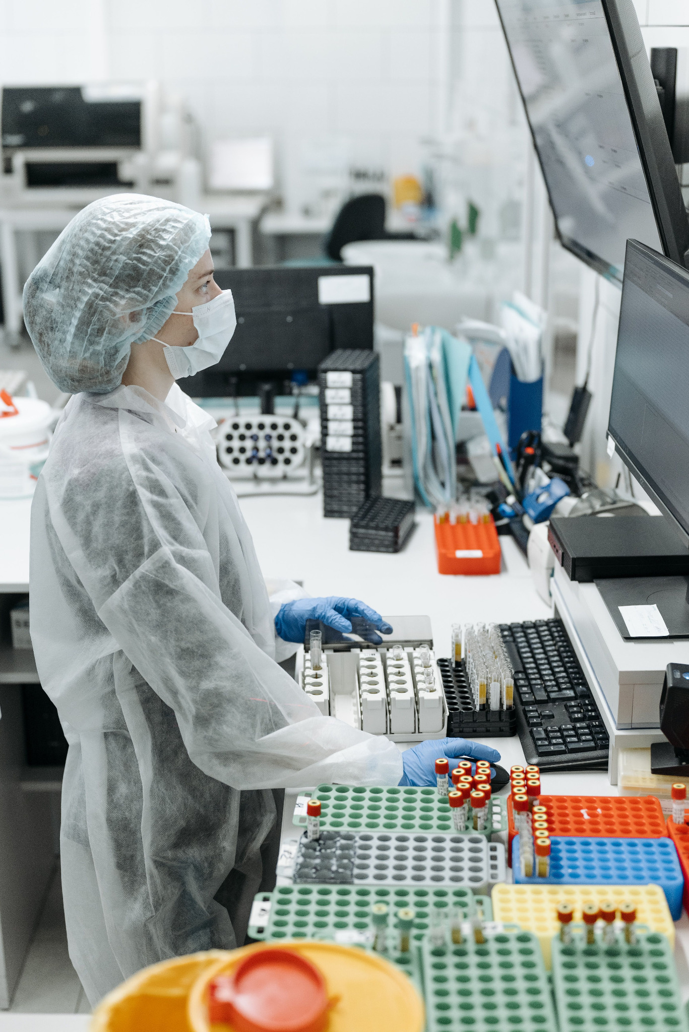 Pharmaceutical laboratory analyst reviewing samples