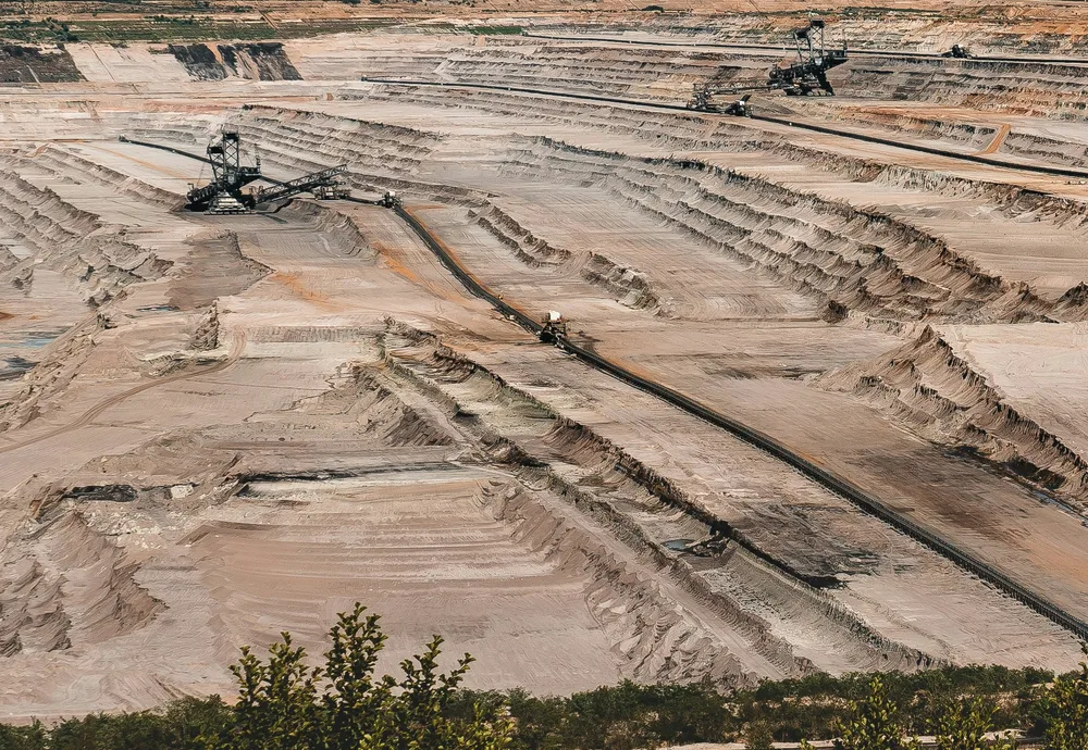 Large open-pit mine with excavation equipment
