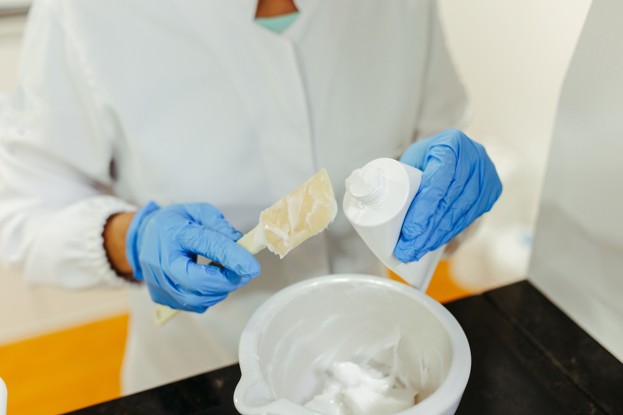 Cream formulation being prepared in a personal care laboratory